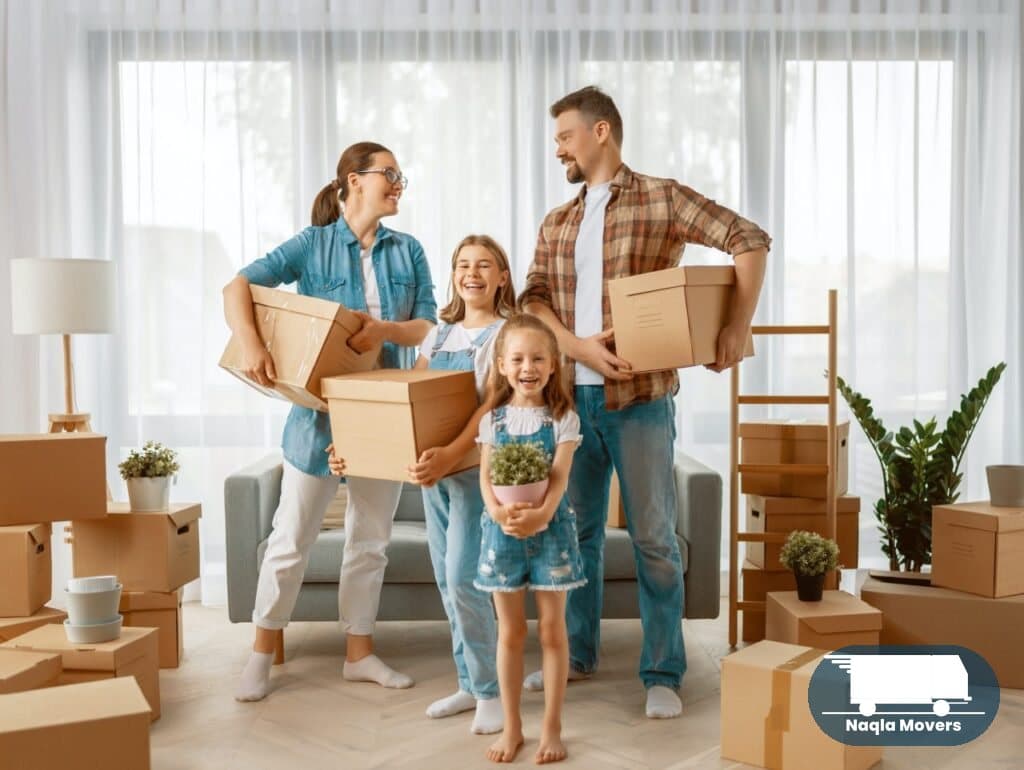 A family unpacking boxes in their new home after a Naqla Movers relocation